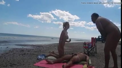 428px x 240px - Nudist girl at the beach teasing naked men to masturbate on her